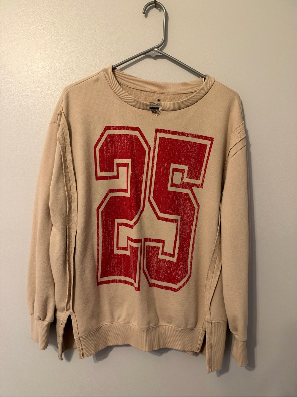 Beige Crewneck Sweatshirt with Red '25' Graphic